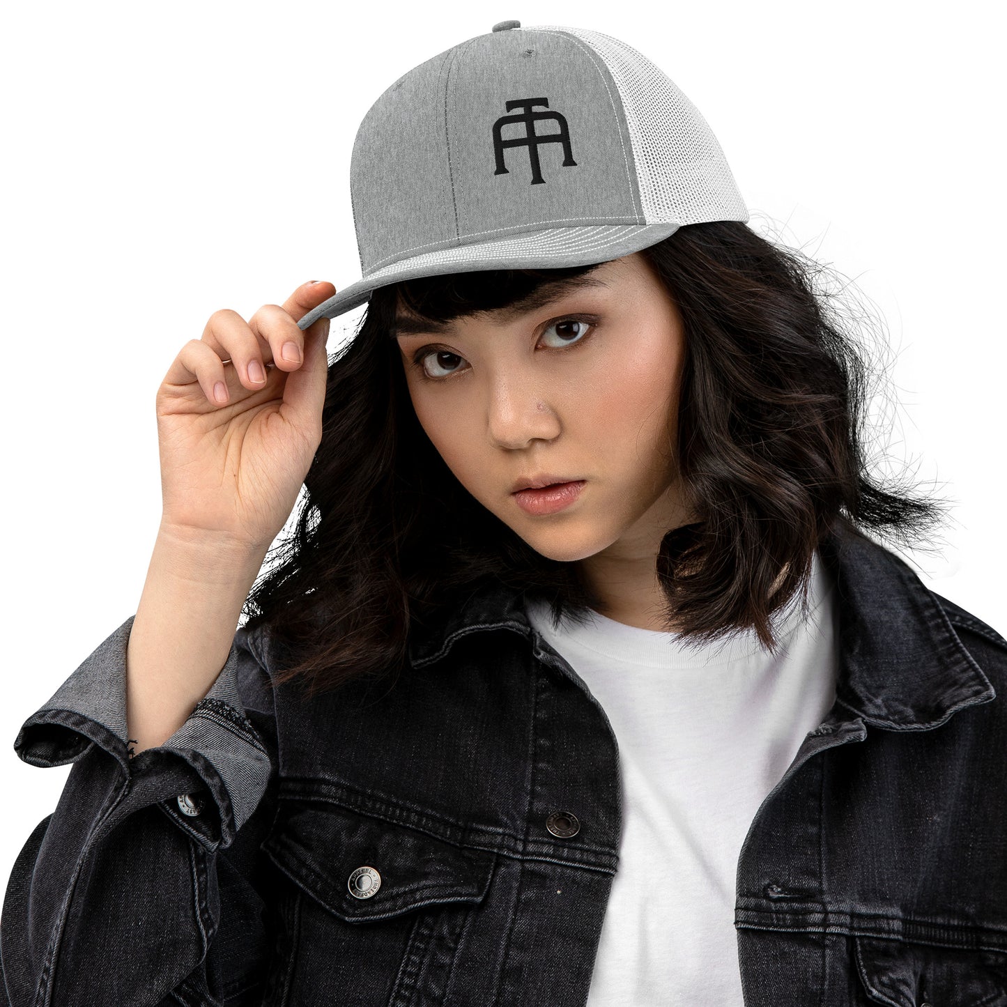 An Athlete Trains structured 6-panel, mid-profile trucker cap is 60% cotton, 40% polyester, 100% polyester mesh back. Pre-curved contrast stitched visor, underbill matches visor color and adjustable plastic snapback