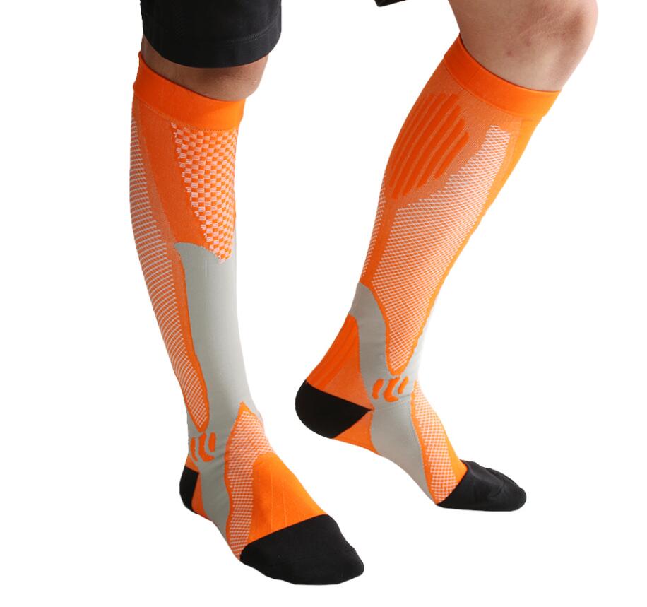 Orange Compression socks to improve performance and aid in muscle recovery. Athletic socks 