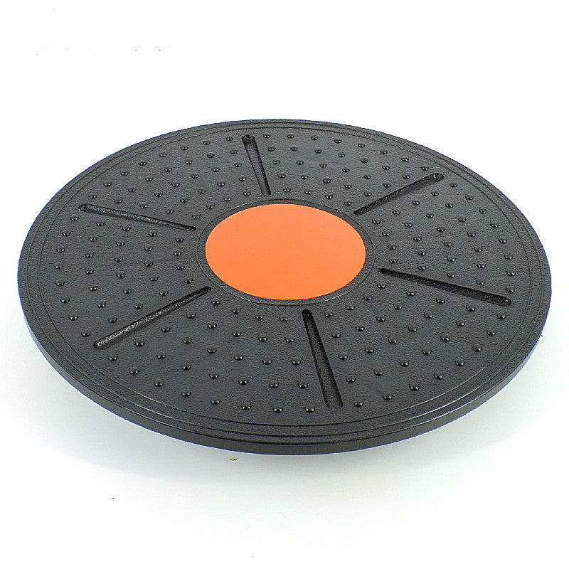 Sturdy balance board with orange center. Balance trainer 