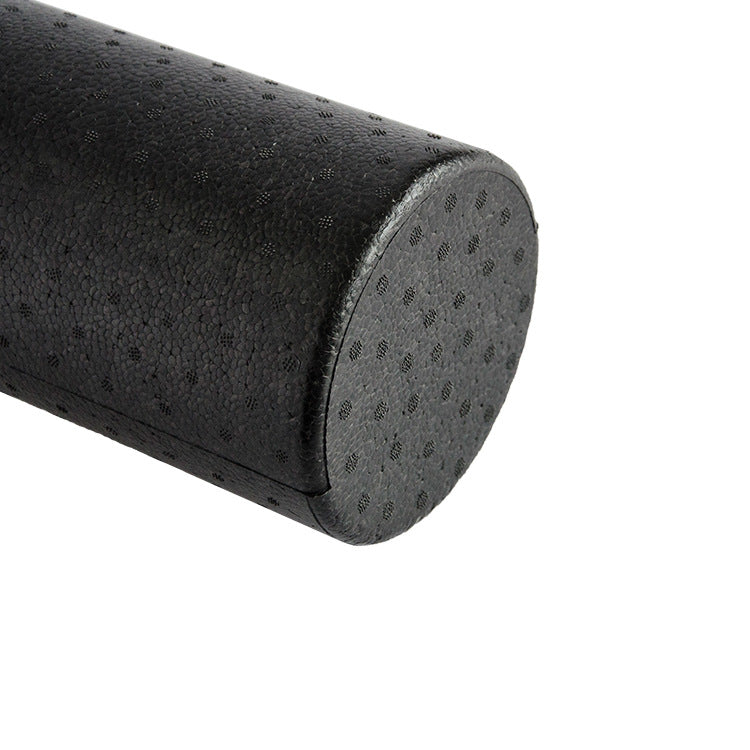 Black foam roller for muscle recovery and maintenance.