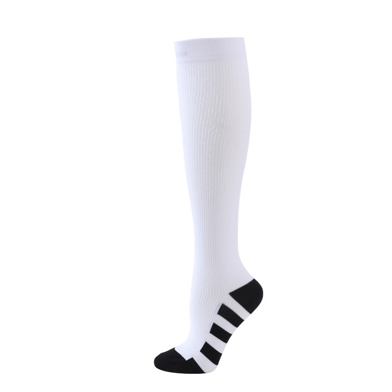 White Compression socks to improve performance and aid in muscle recovery. Athletic socks 