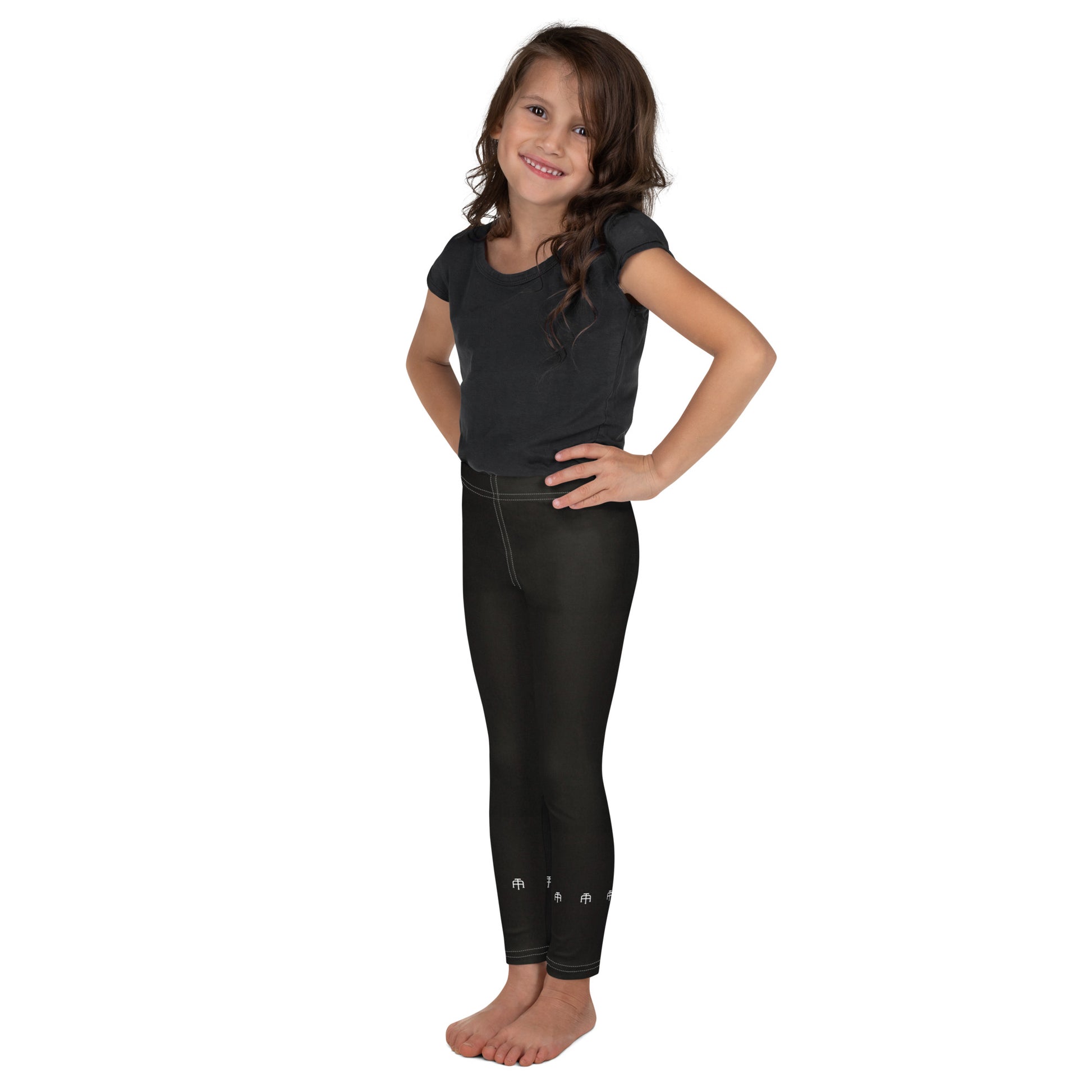 Black soft microfiber kids leggings with an elastic waistband by An Athlete Trains