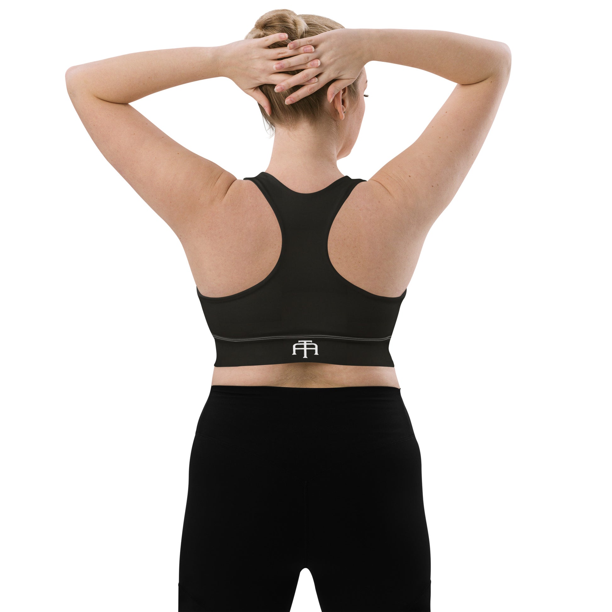 Black sports bra performance activewear. Compression fabric with sports mesh lining.