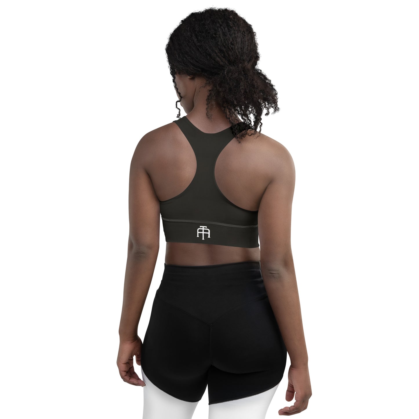 Black sports bra performance activewear. Compression fabric with sports mesh lining.