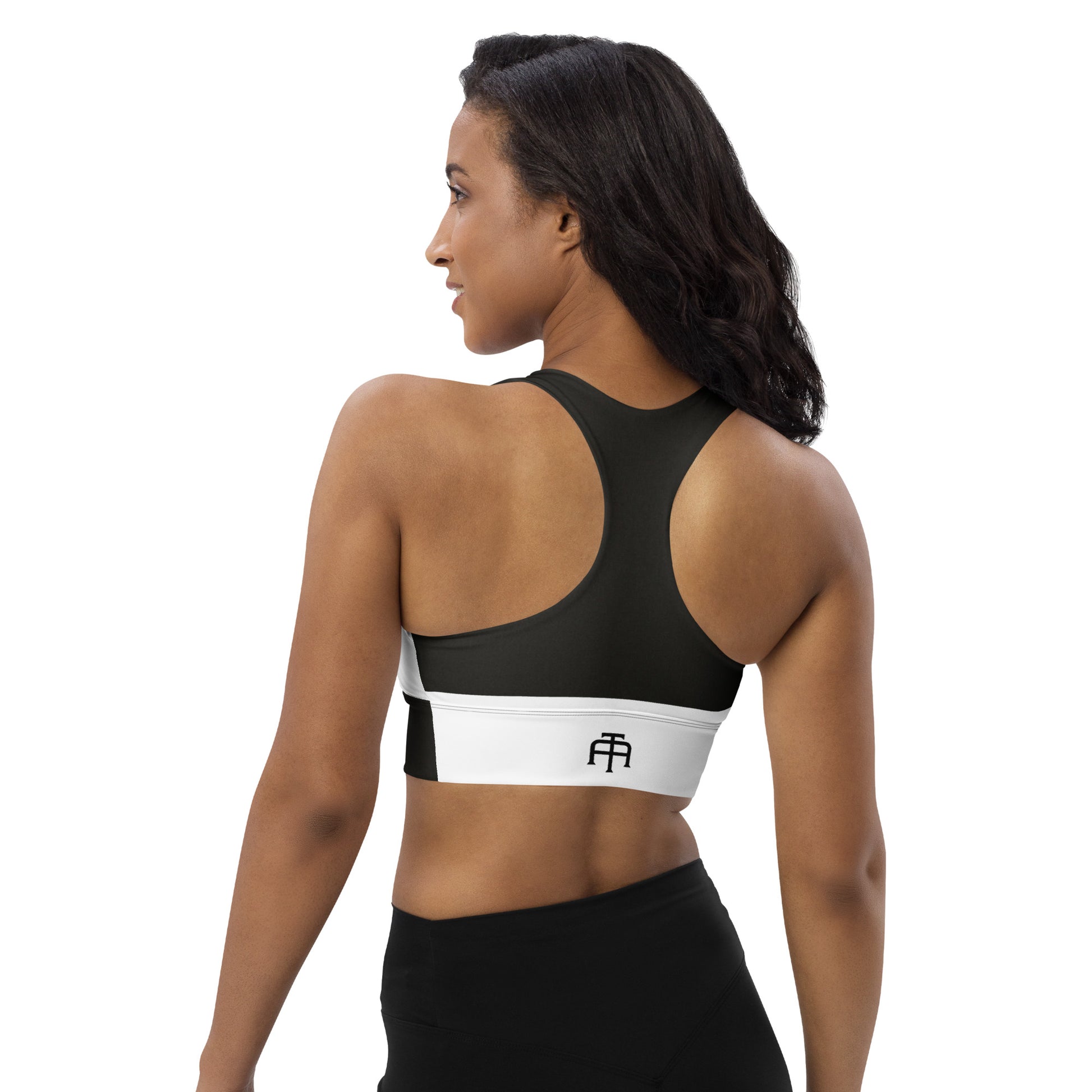 White and black sports bra performance activewear. Compression fabric with sports mesh lining.