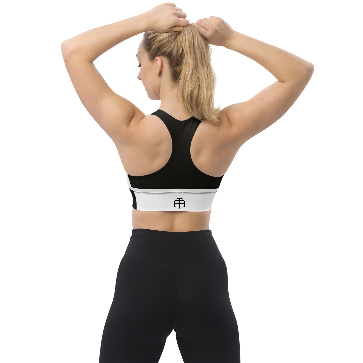 White and black sports bra performance activewear. Compression fabric with sports mesh lining.