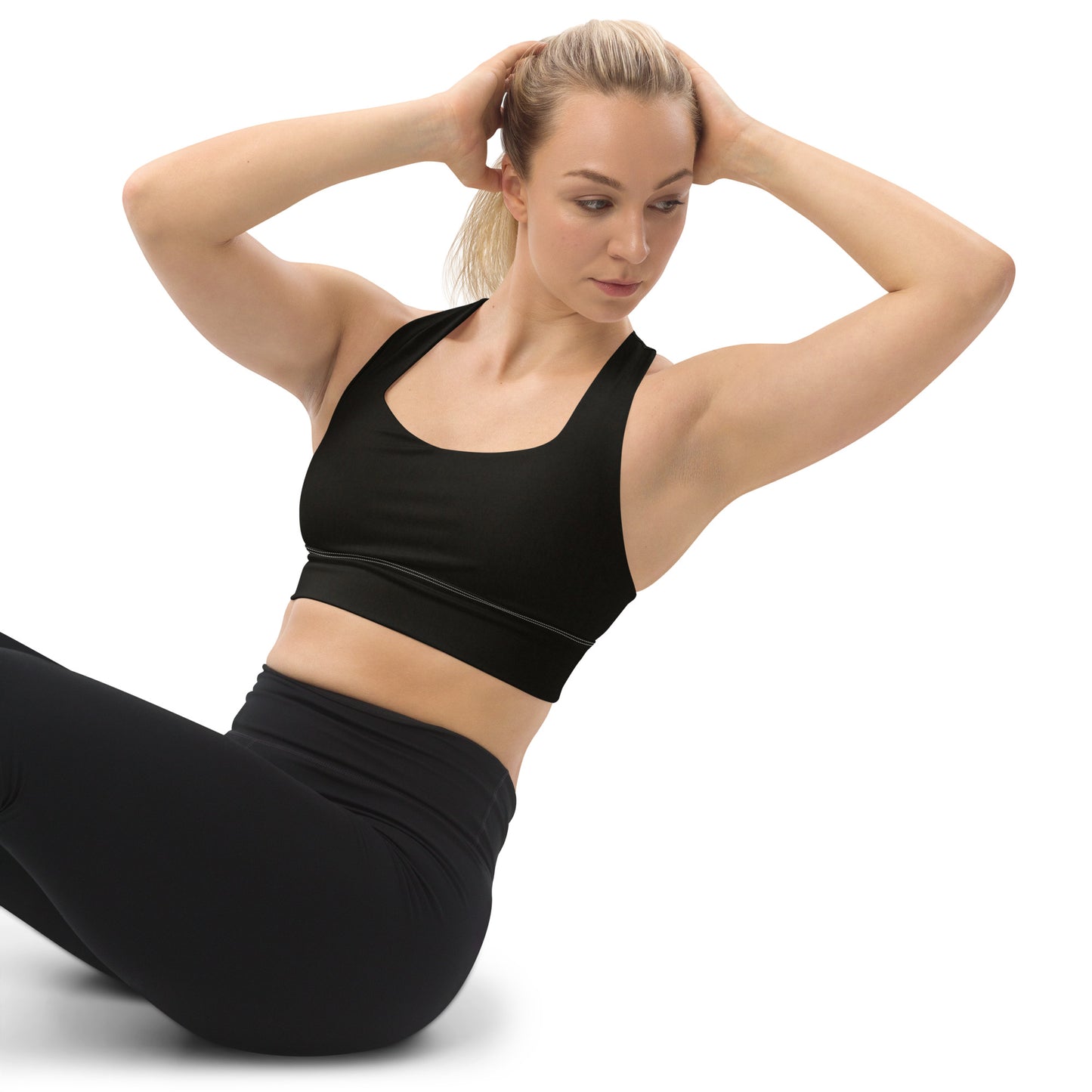 Black sports bra performance activewear. Compression fabric with sports mesh lining.