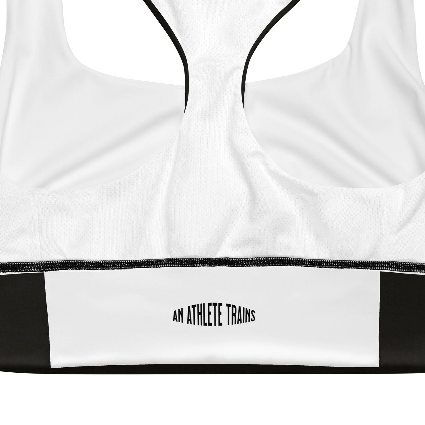 White and black sports bra performance activewear. Compression fabric with sports mesh lining.