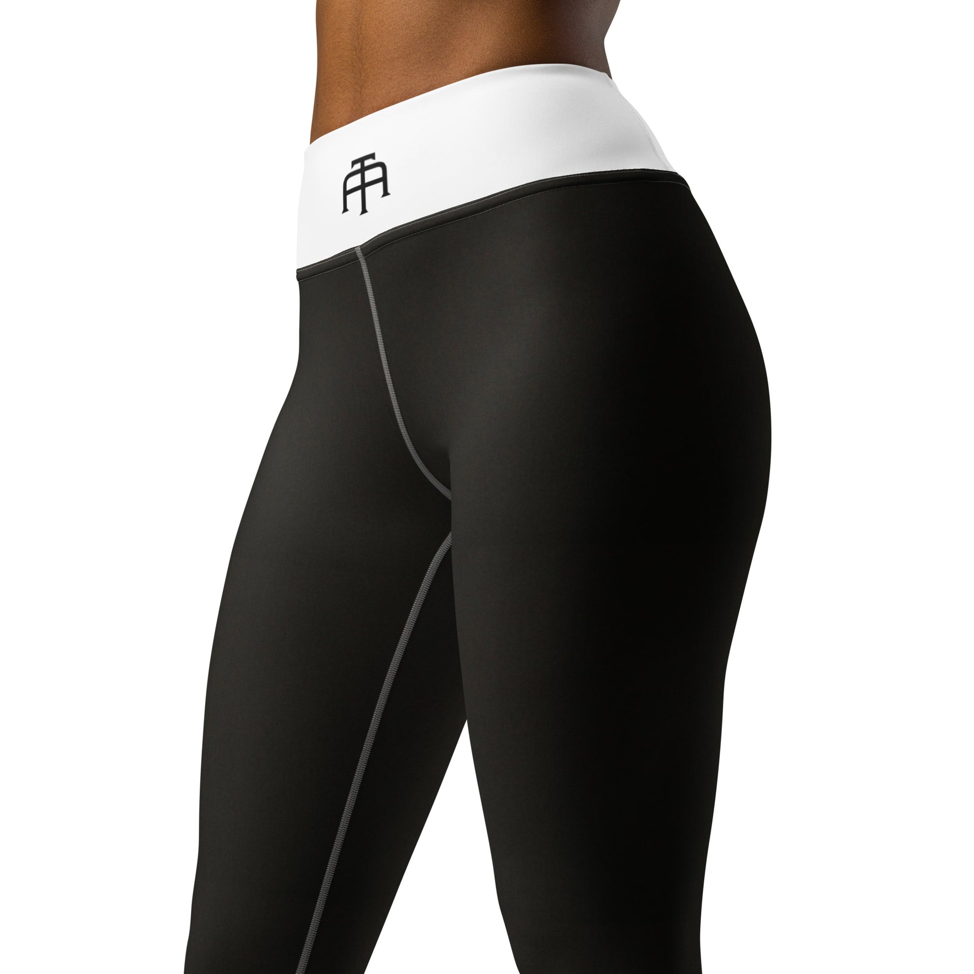 Black yoga pants by An Athlete Trains. White yoga leggings