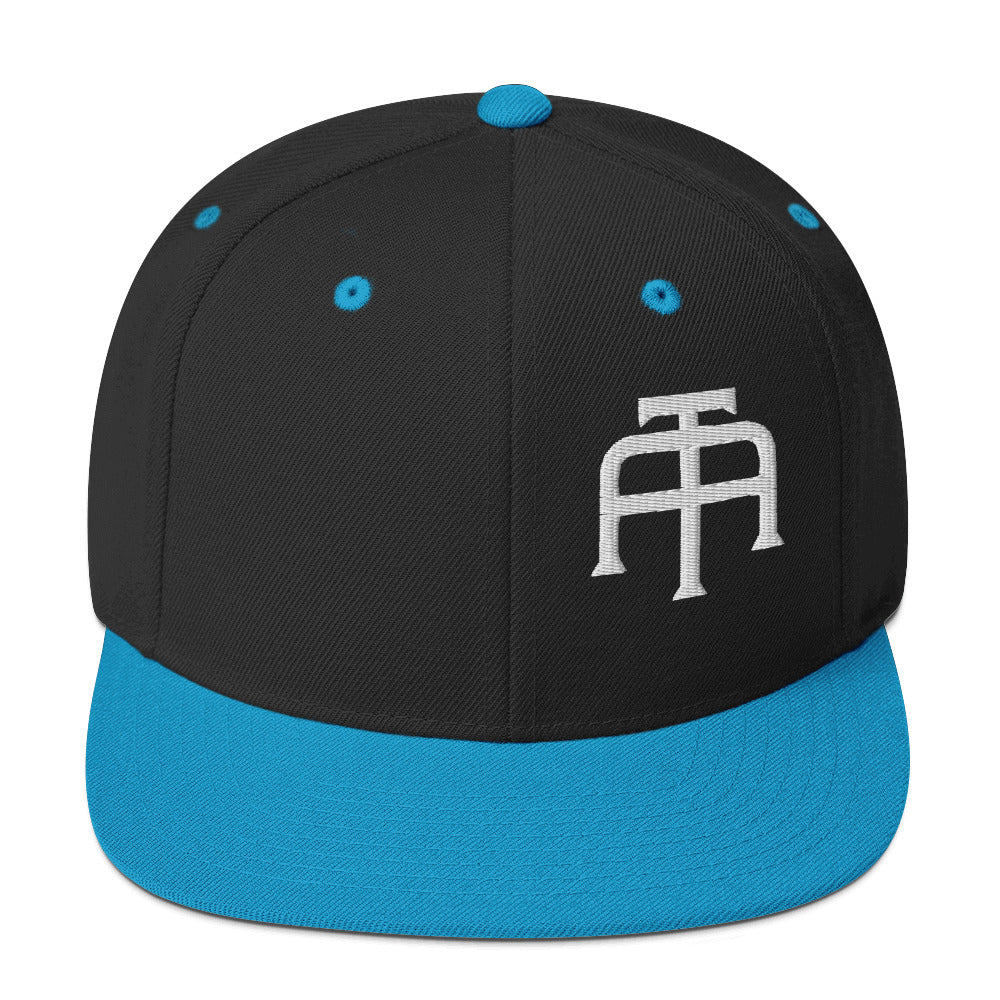 An Athlete Trains structured hat with a classic fit, flat brim, full buckram, and adjustable snap closure.