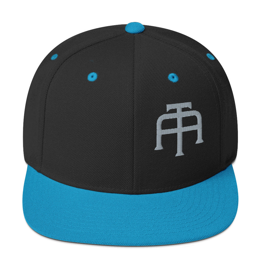 An Athlete Trains structured hat with a classic fit, flat brim, full buckram, and adjustable snap closure.