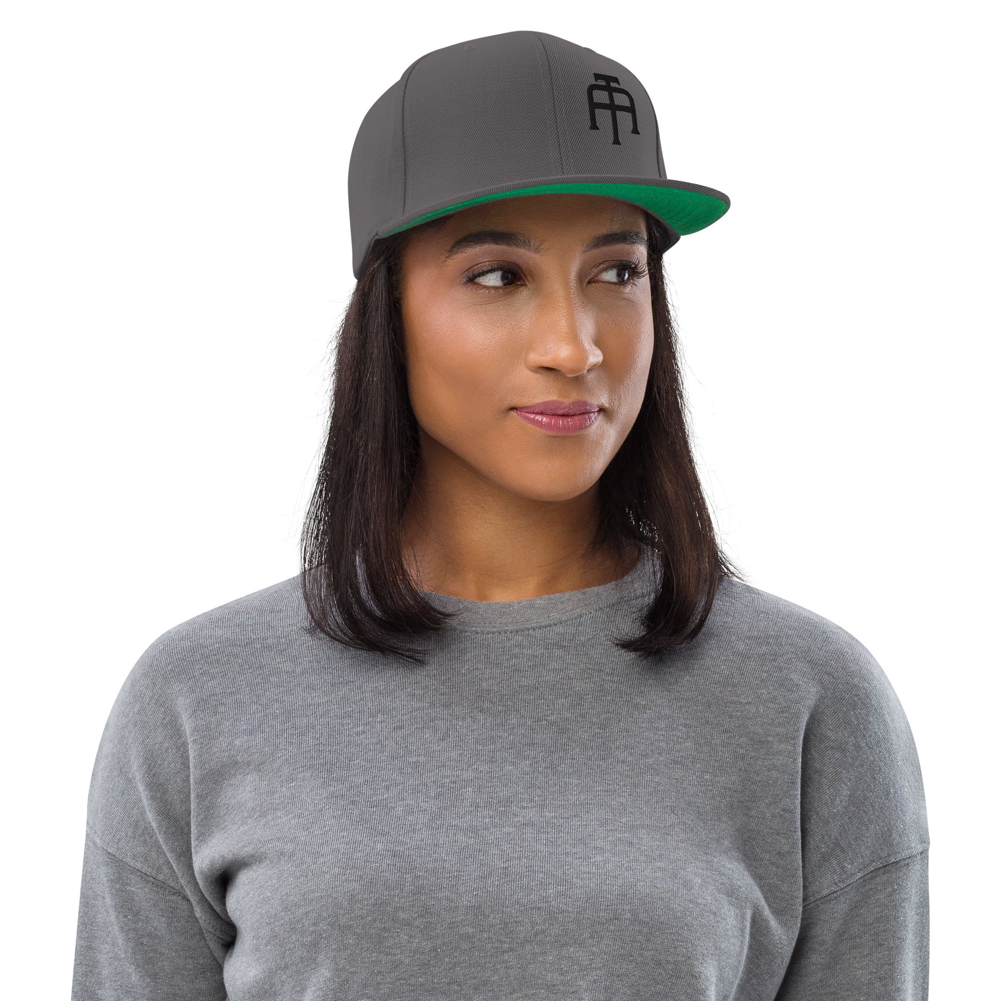 An Athlete Trains structured hat with a classic fit, flat brim, full buckram, and adjustable snap closure.