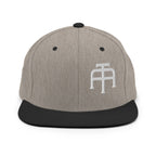An Athlete Trains structured hat with a classic fit, flat brim, full buckram, and adjustable snap closure.