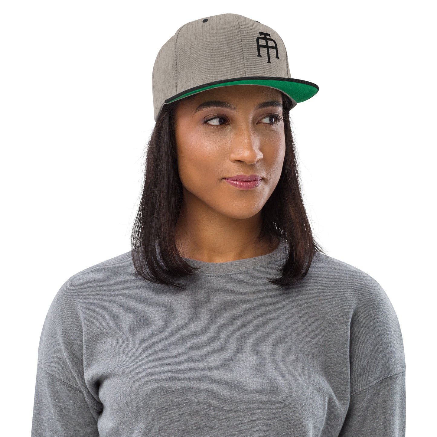 An Athlete Trains structured hat with a classic fit, flat brim, full buckram, and adjustable snap closure.