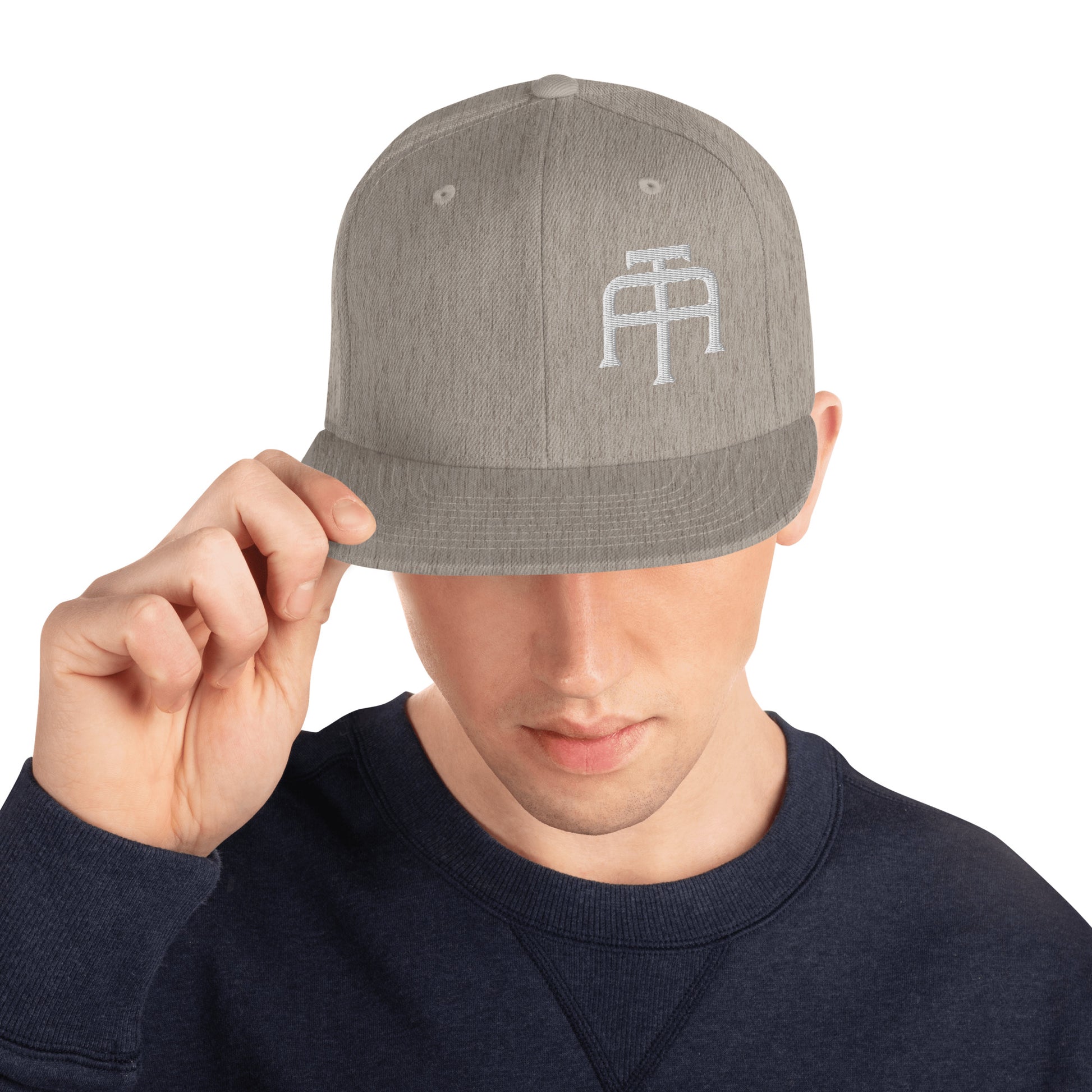 An Athlete Trains structured hat with a classic fit, flat brim, full buckram, and adjustable snap closure.