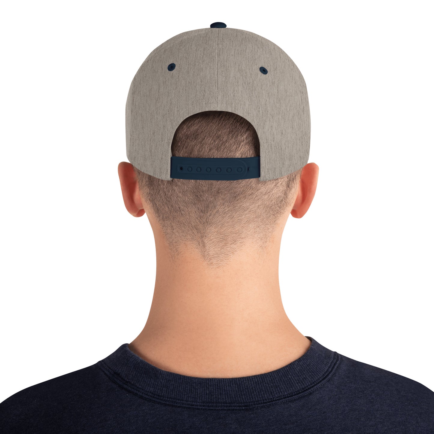 An Athlete Trains structured hat with a classic fit, flat brim, full buckram, and adjustable snap closure.