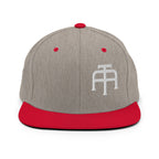 An Athlete Trains structured hat with a classic fit, flat brim, full buckram, and adjustable snap closure.