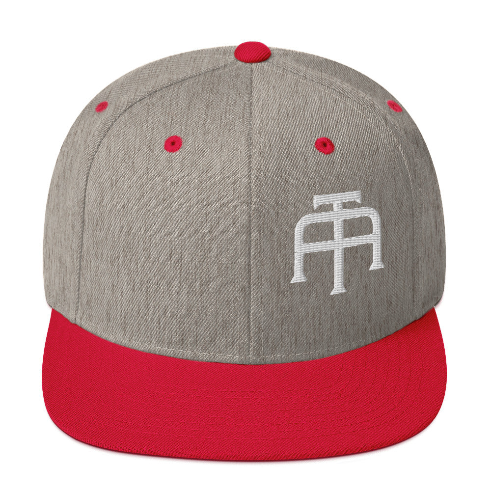 An Athlete Trains structured hat with a classic fit, flat brim, full buckram, and adjustable snap closure.