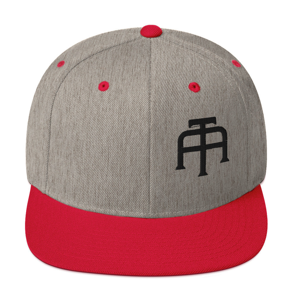 An Athlete Trains structured hat with a classic fit, flat brim, full buckram, and adjustable snap closure.