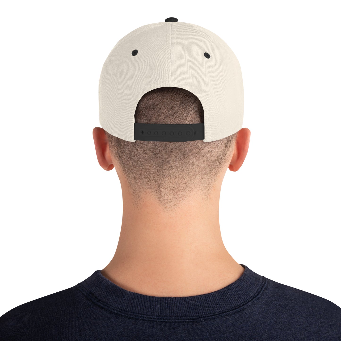 An Athlete Trains structured hat with a classic fit, flat brim, full buckram, and adjustable snap closure.