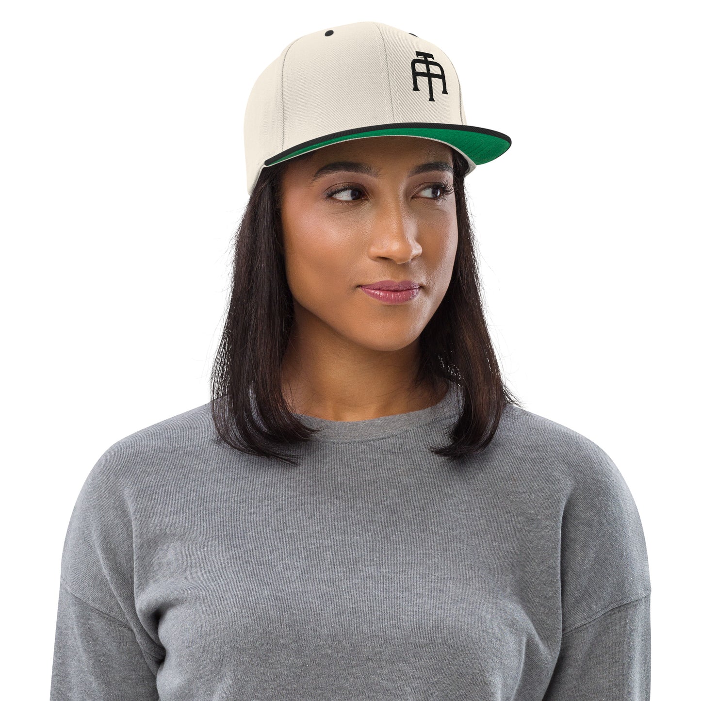 An Athlete Trains structured hat with a classic fit, flat brim, full buckram, and adjustable snap closure.