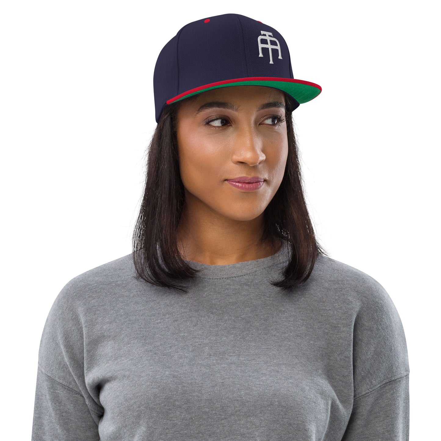 An Athlete Trains structured hat with a classic fit, flat brim, full buckram, and adjustable snap closure.