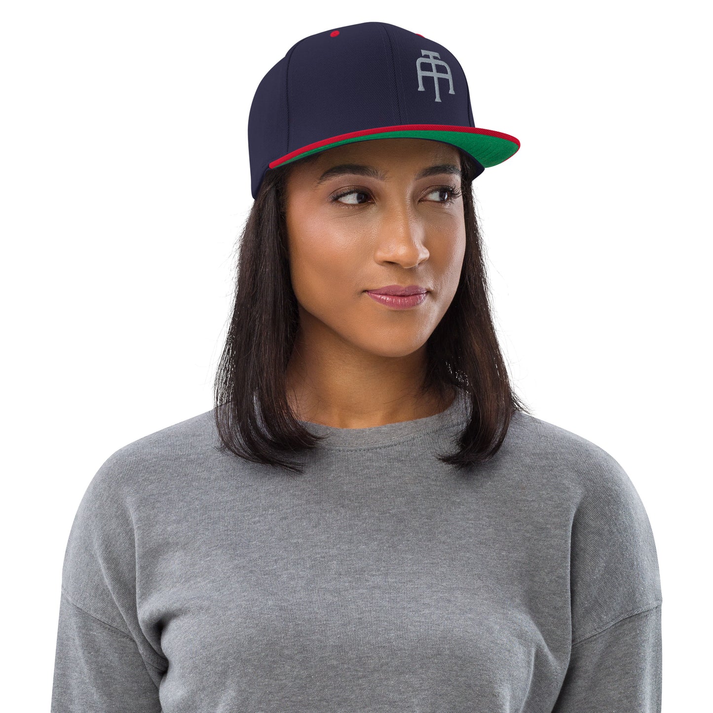 An Athlete Trains structured hat with a classic fit, flat brim, full buckram, and adjustable snap closure.