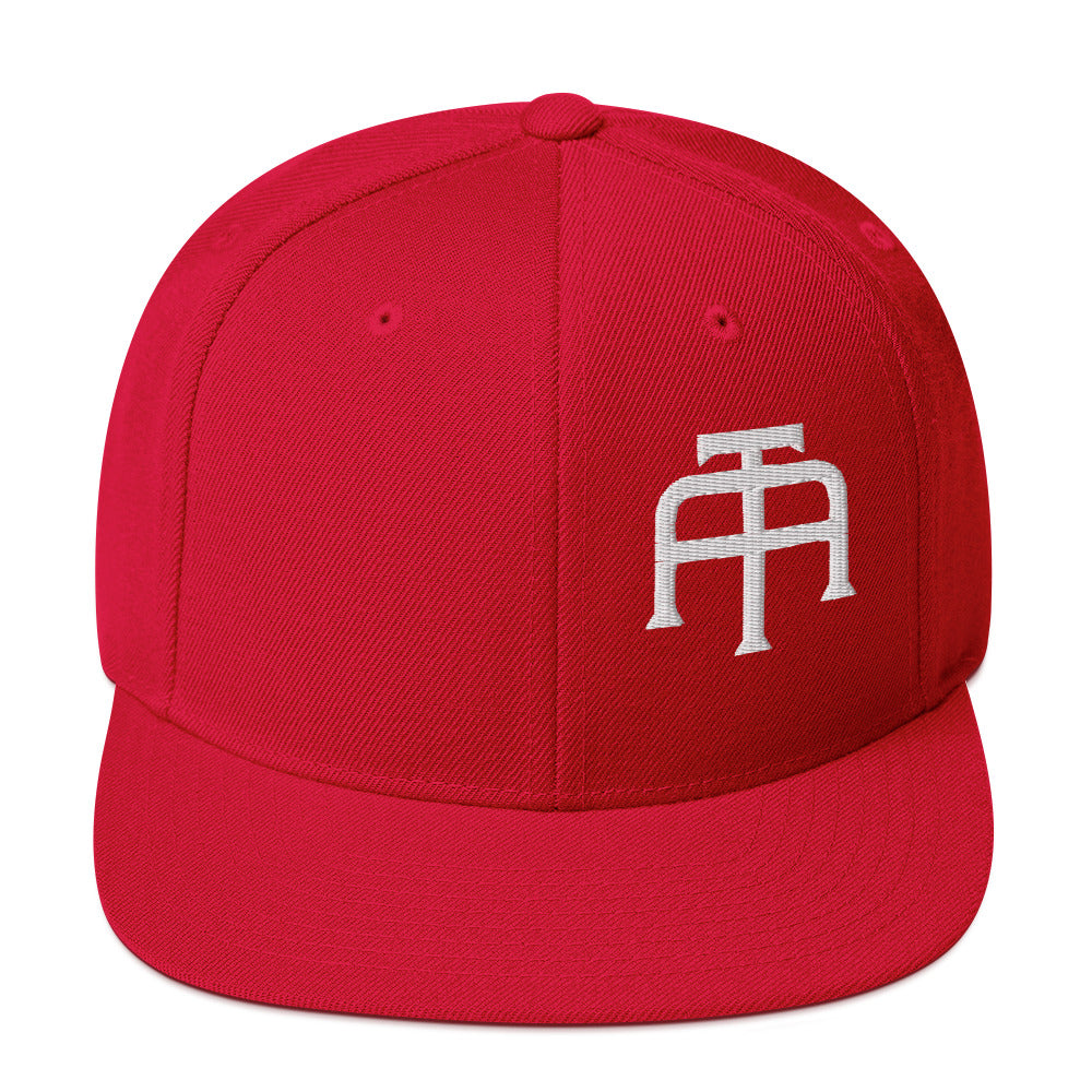 An Athlete Trains structured hat with a classic fit, flat brim, full buckram, and adjustable snap closure.