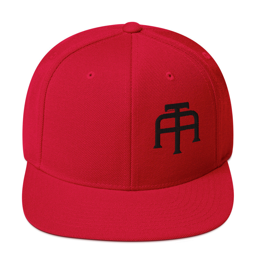 An Athlete Trains structured hat with a classic fit, flat brim, full buckram, and adjustable snap closure.