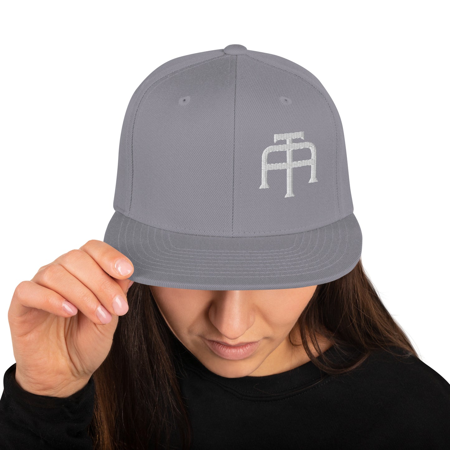 An Athlete Trains structured hat with a classic fit, flat brim, full buckram, and adjustable snap closure.