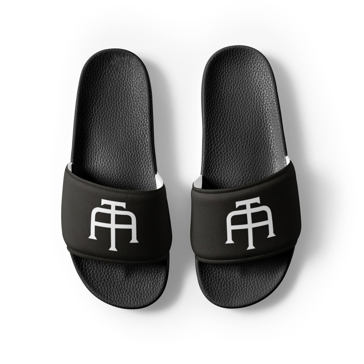 Men’s black slides with cushioned upper strap, textured footbed and a faux leather upper