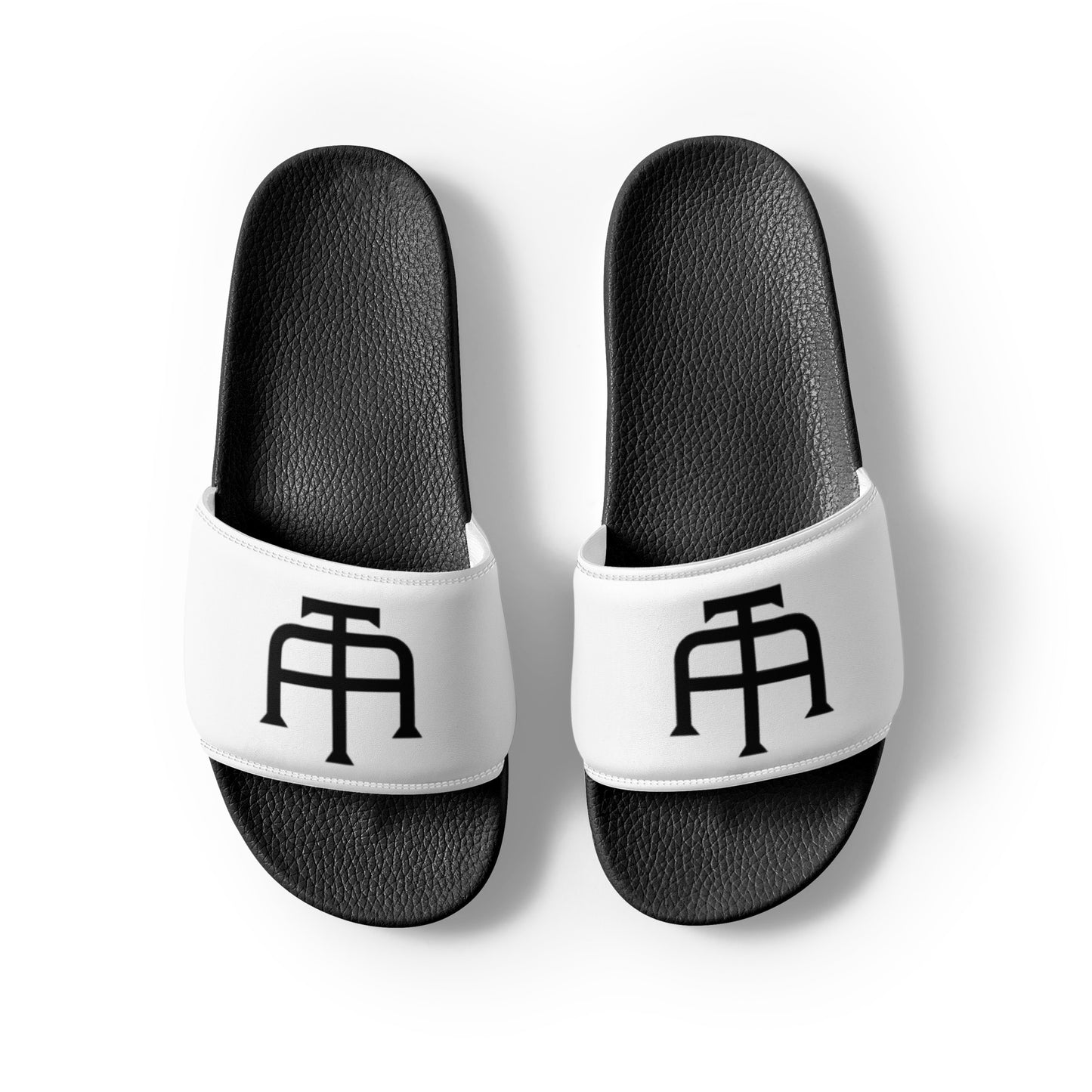 Men’s black slides with cushioned upper strap, textured footbed and a white faux leather upper