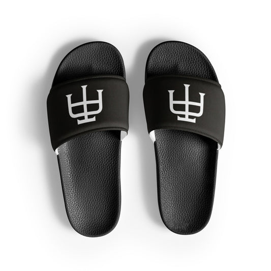 Men’s black slides with cushioned upper strap, textured footbed and a faux leather upper