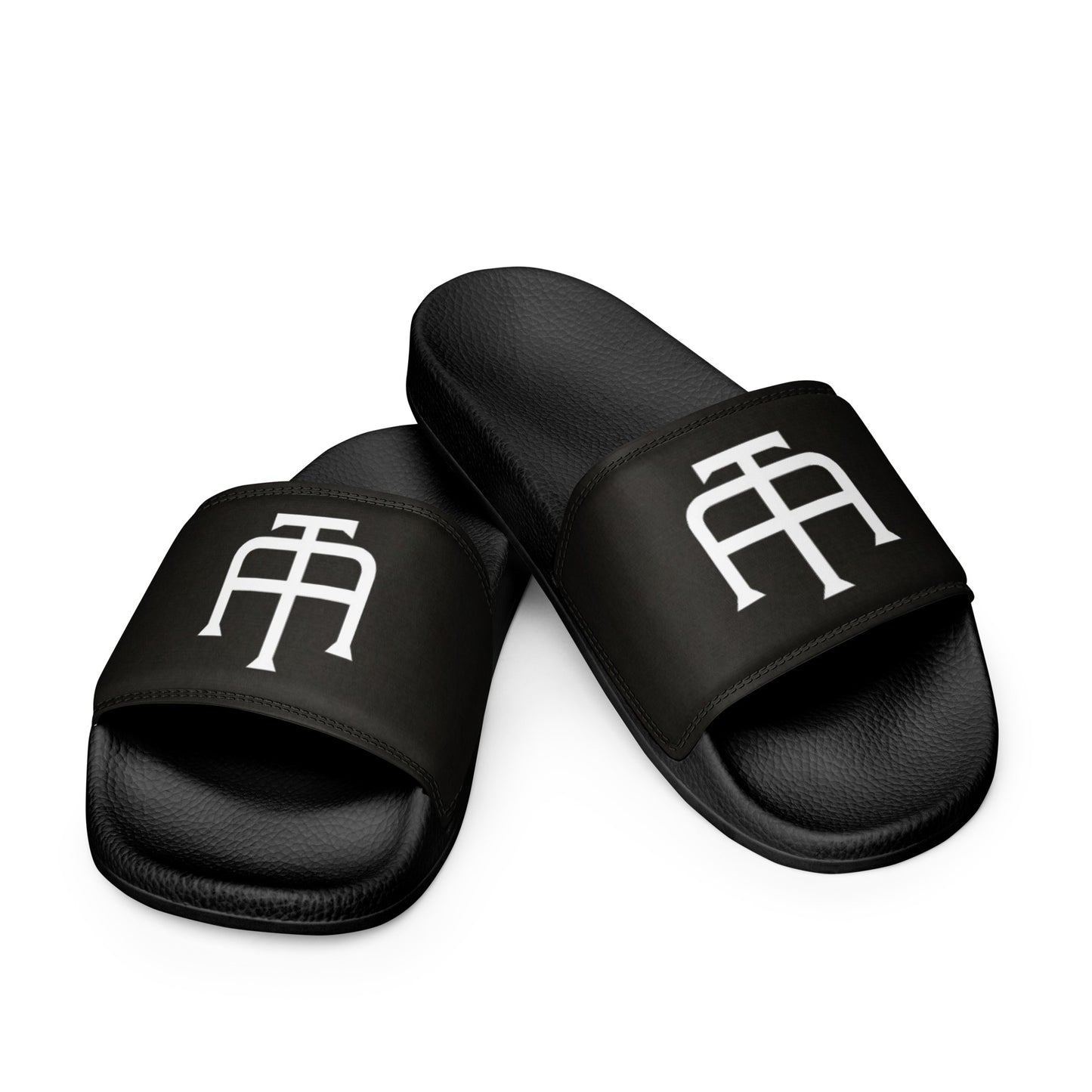 Men’s black slides with cushioned upper strap, textured footbed and a faux leather upper