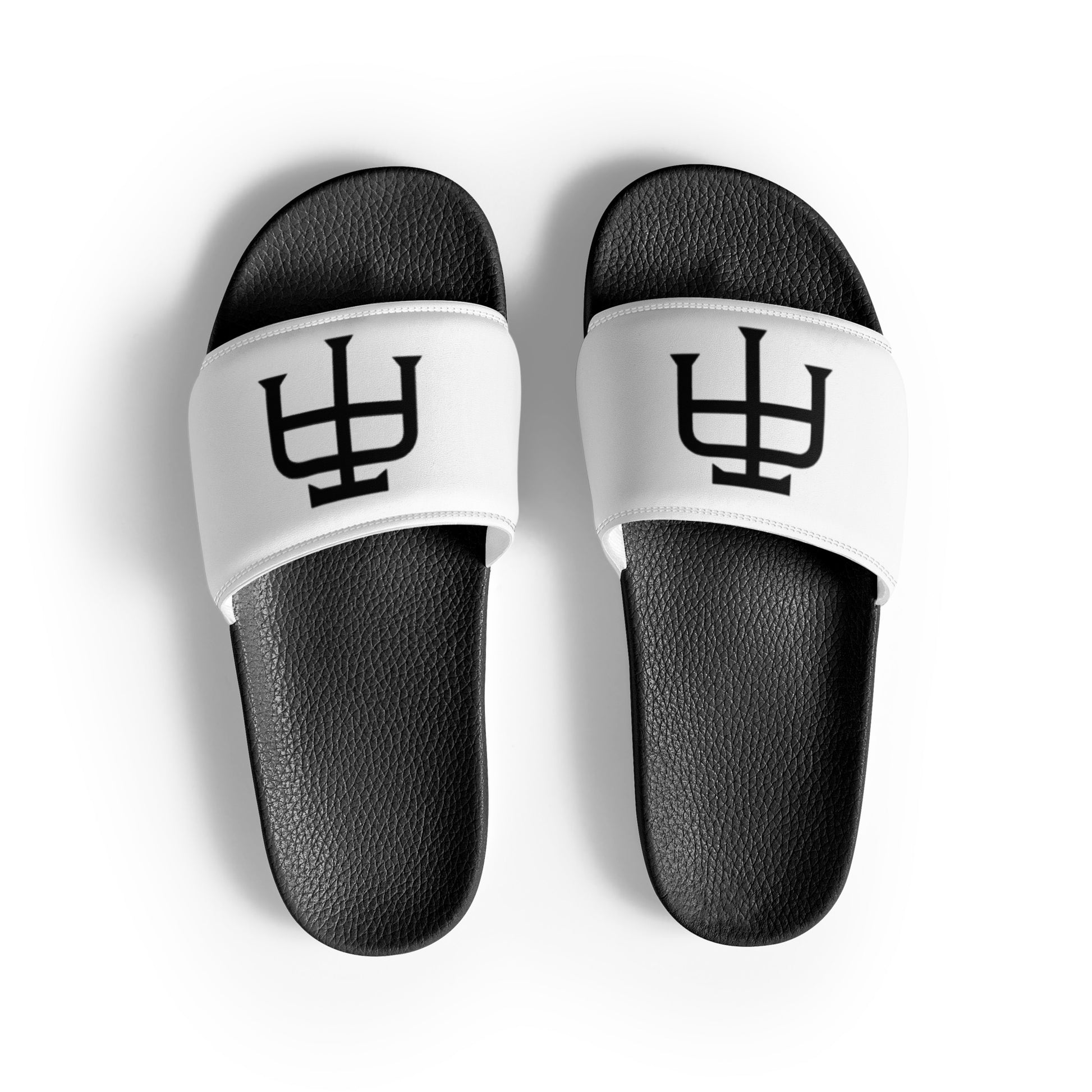 Men’s black slides with cushioned upper strap, textured footbed and a white faux leather upper