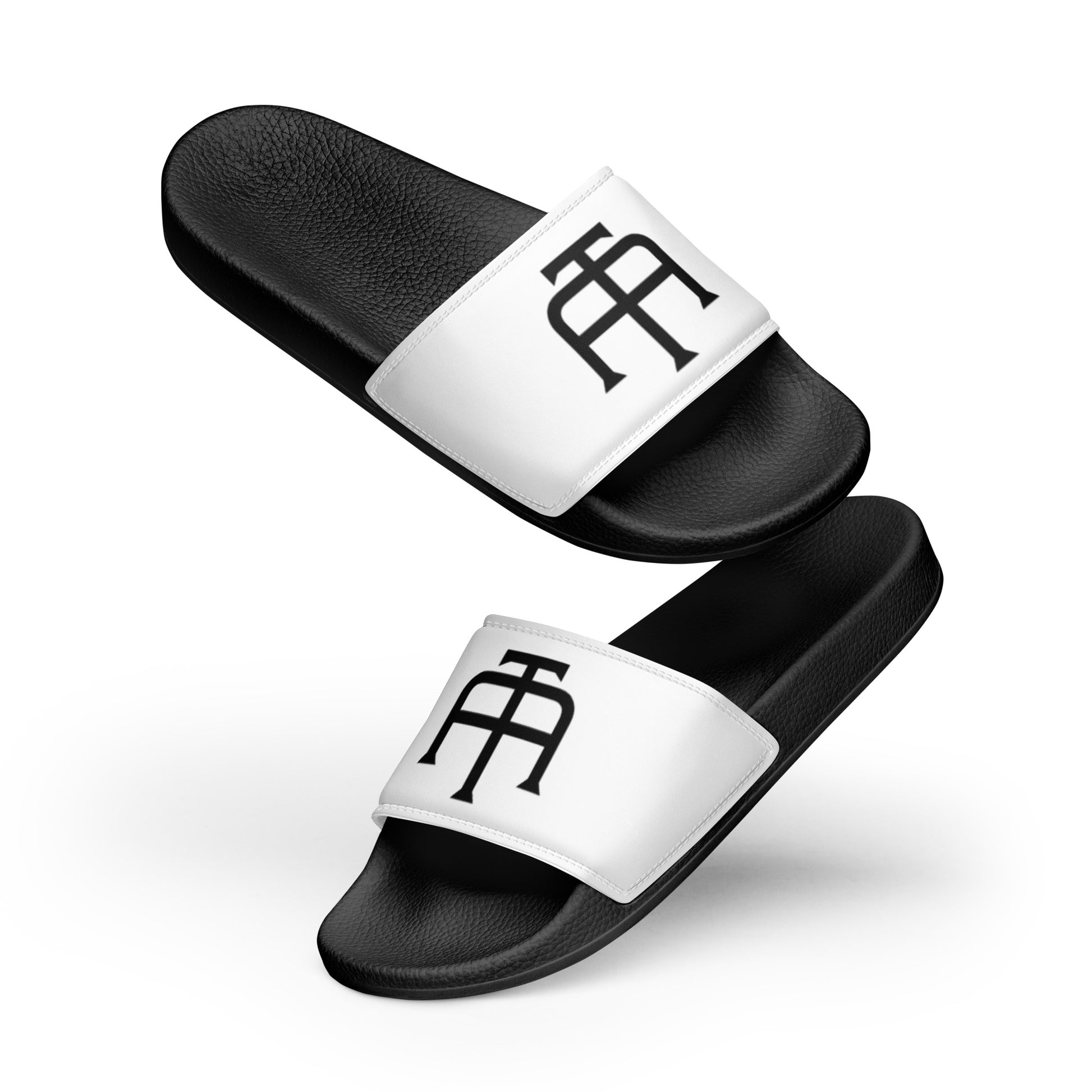 Men’s black slides with cushioned upper strap, textured footbed and a white faux leather upper