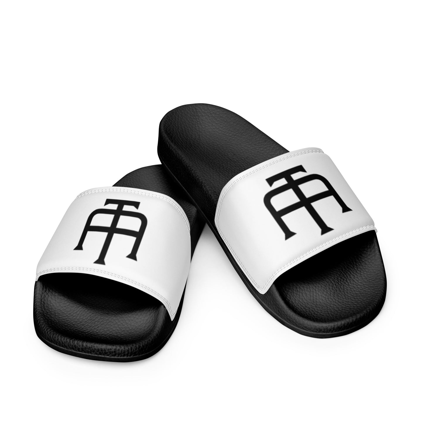 Men’s black slides with cushioned upper strap, textured footbed and a white faux leather upper