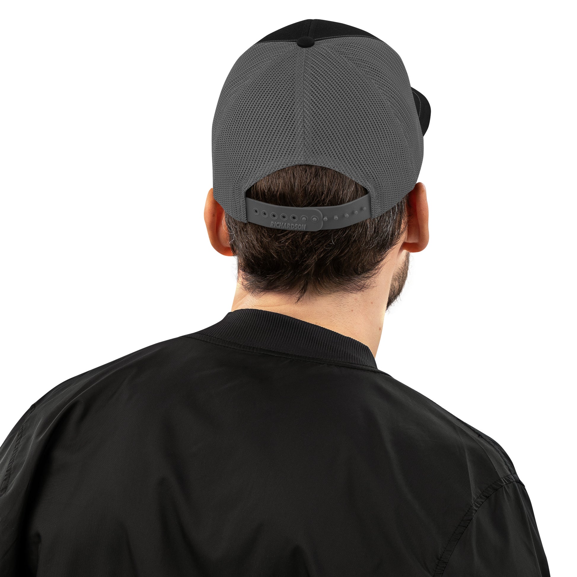 An Athlete Trains structured 6-panel, mid-profile trucker cap is 60% cotton, 40% polyester, 100% polyester mesh back. Pre-curved contrast stitched visor, underbill matches visor color and adjustable plastic snapback