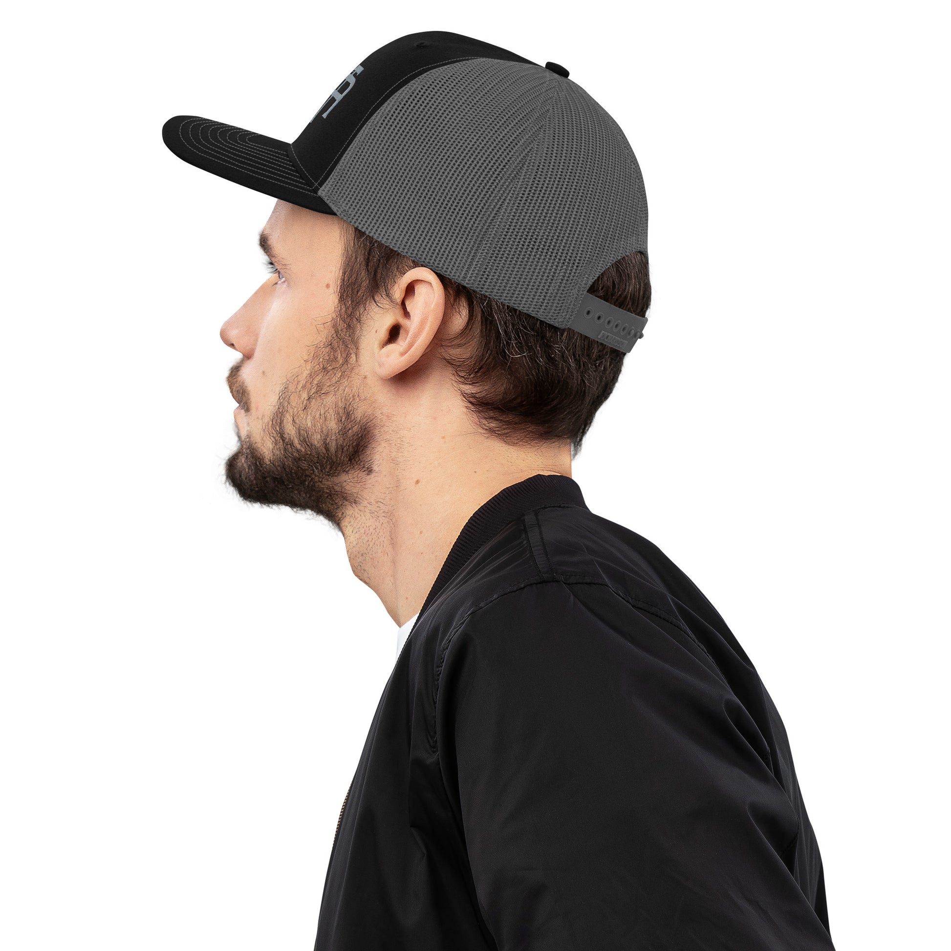 An Athlete Trains structured 6-panel, mid-profile trucker cap is 60% cotton, 40% polyester, 100% polyester mesh back. Pre-curved contrast stitched visor, underbill matches visor color and adjustable plastic snapback