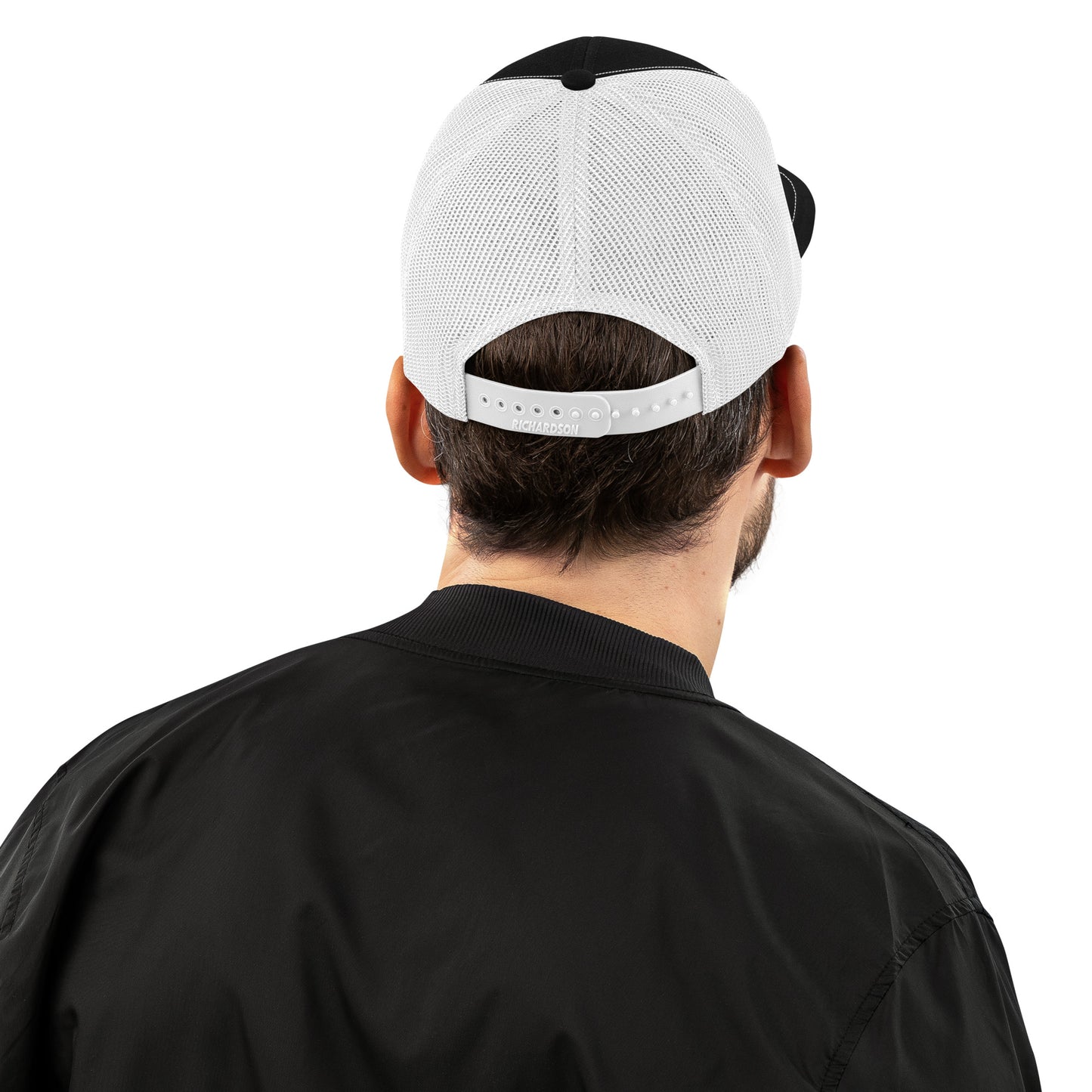 An Athlete Trains structured 6-panel, mid-profile trucker cap is 60% cotton, 40% polyester, 100% polyester mesh back. Pre-curved contrast stitched visor, underbill matches visor color and adjustable plastic snapback