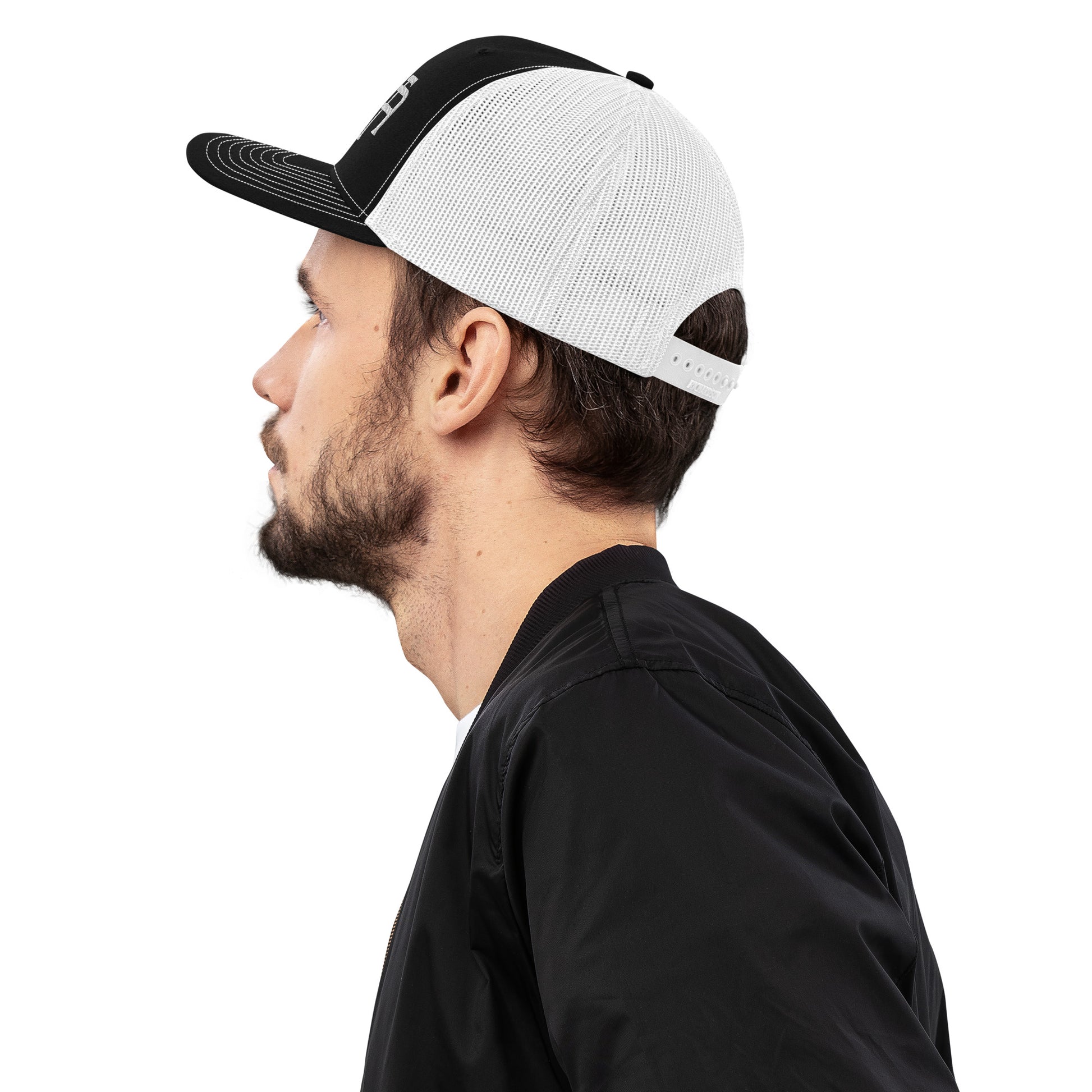 An Athlete Trains structured 6-panel, mid-profile trucker cap is 60% cotton, 40% polyester, 100% polyester mesh back. Pre-curved contrast stitched visor, underbill matches visor color and adjustable plastic snapback