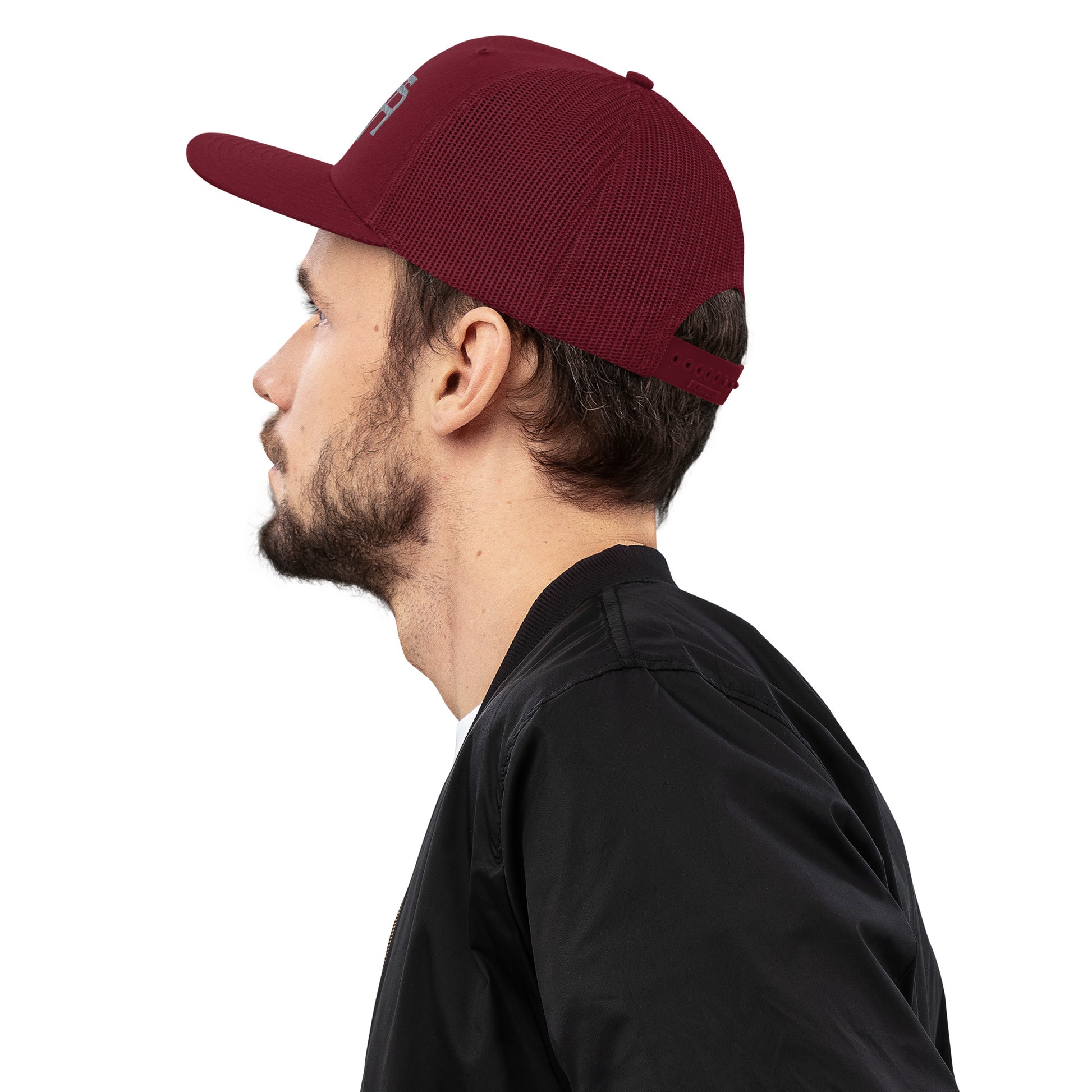 An Athlete Trains structured 6-panel, mid-profile trucker cap is 60% cotton, 40% polyester, 100% polyester mesh back. Pre-curved contrast stitched visor, underbill matches visor color and adjustable plastic snapback