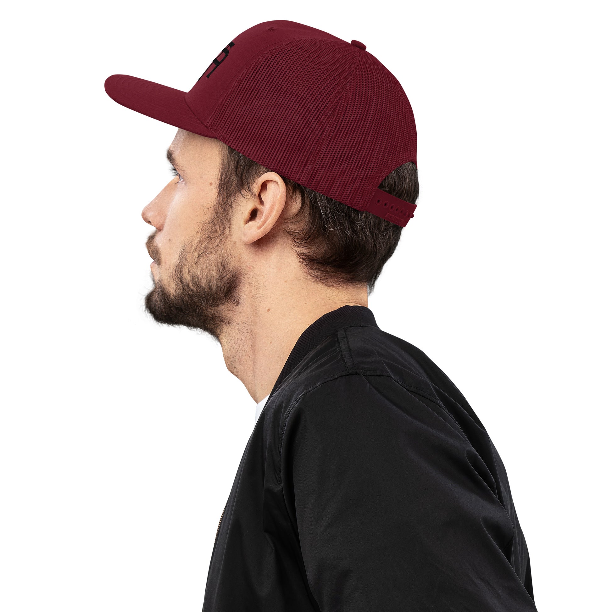 An Athlete Trains structured 6-panel, mid-profile trucker cap is 60% cotton, 40% polyester, 100% polyester mesh back. Pre-curved contrast stitched visor, underbill matches visor color and adjustable plastic snapback