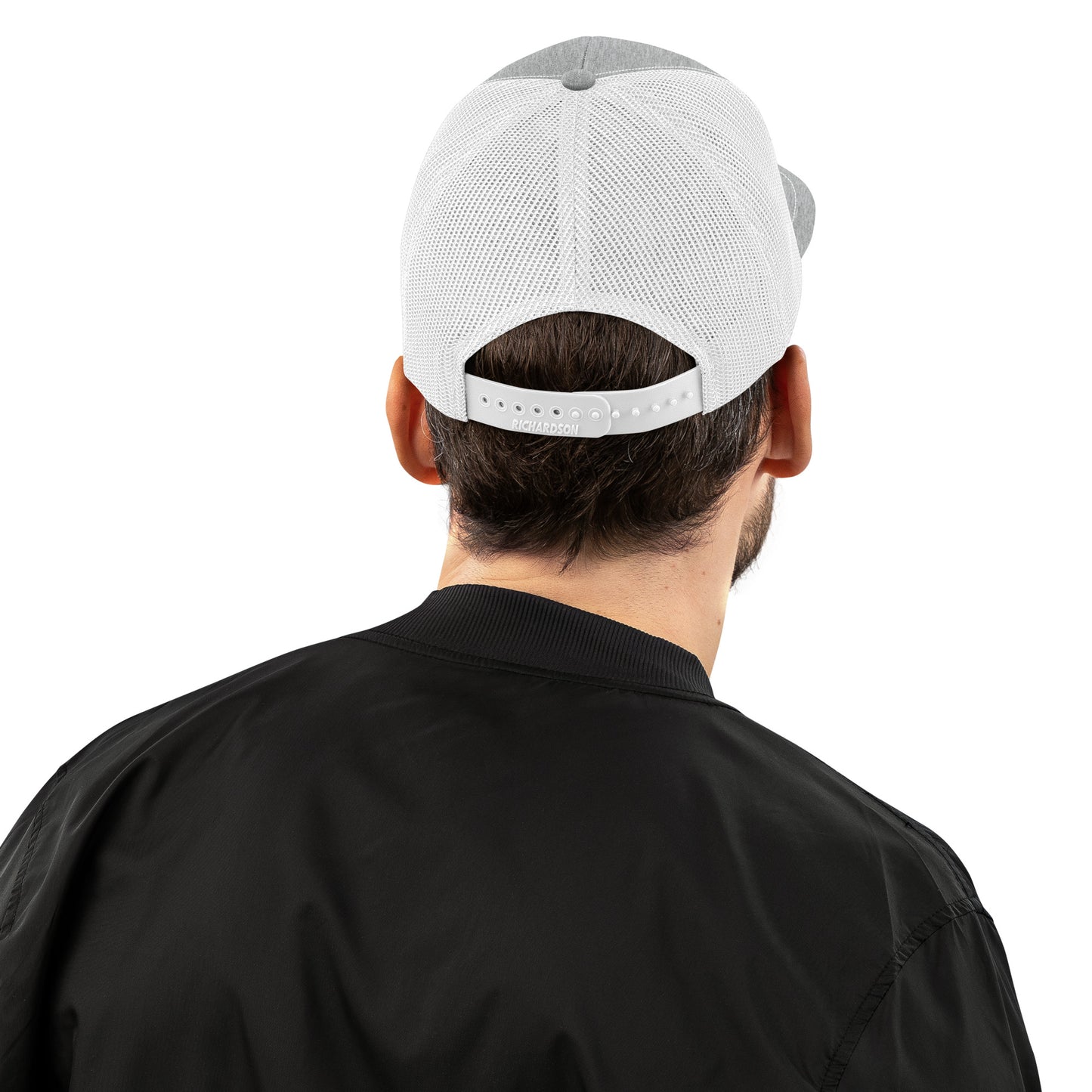 An Athlete Trains structured 6-panel, mid-profile trucker cap is 60% cotton, 40% polyester, 100% polyester mesh back. Pre-curved contrast stitched visor, underbill matches visor color and adjustable plastic snapback