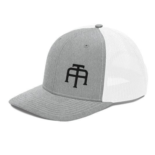 An Athlete Trains structured 6-panel, mid-profile trucker cap is 60% cotton, 40% polyester, 100% polyester mesh back. Pre-curved contrast stitched visor, underbill matches visor color and adjustable plastic snapback