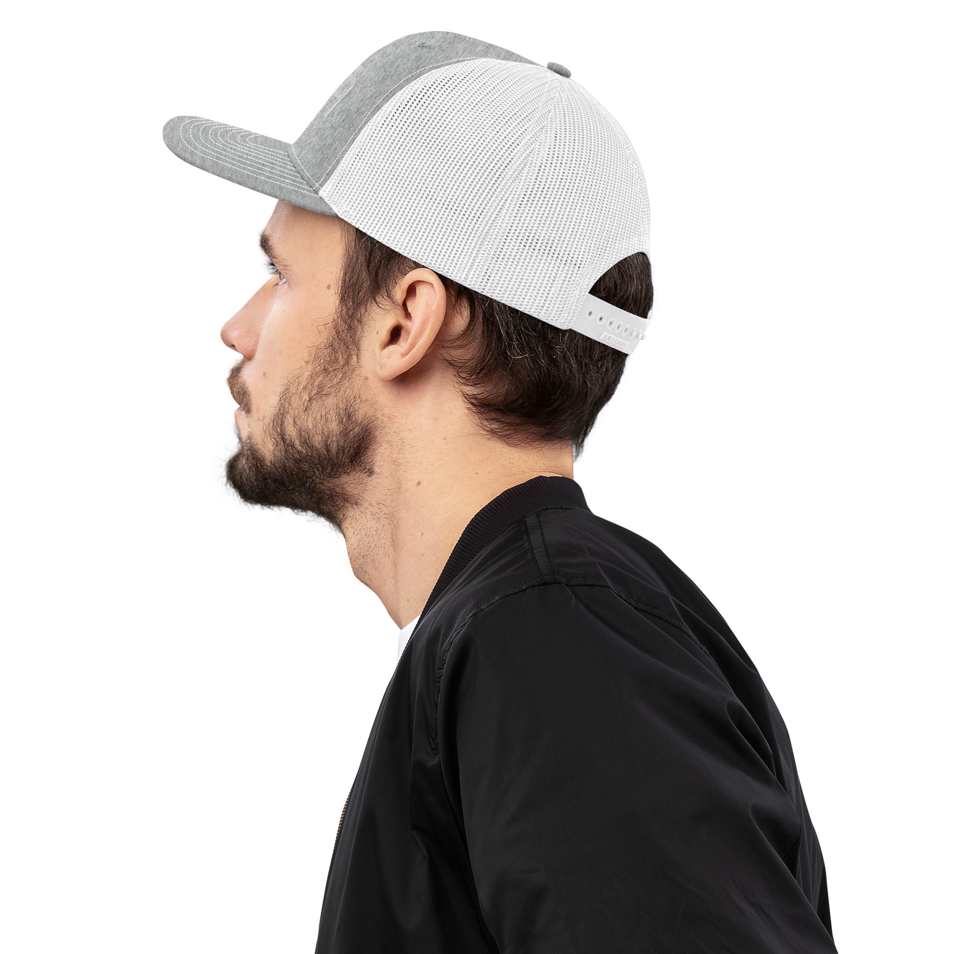 An Athlete Trains structured 6-panel, mid-profile trucker cap is 60% cotton, 40% polyester, 100% polyester mesh back. Pre-curved contrast stitched visor, underbill matches visor color and adjustable plastic snapback