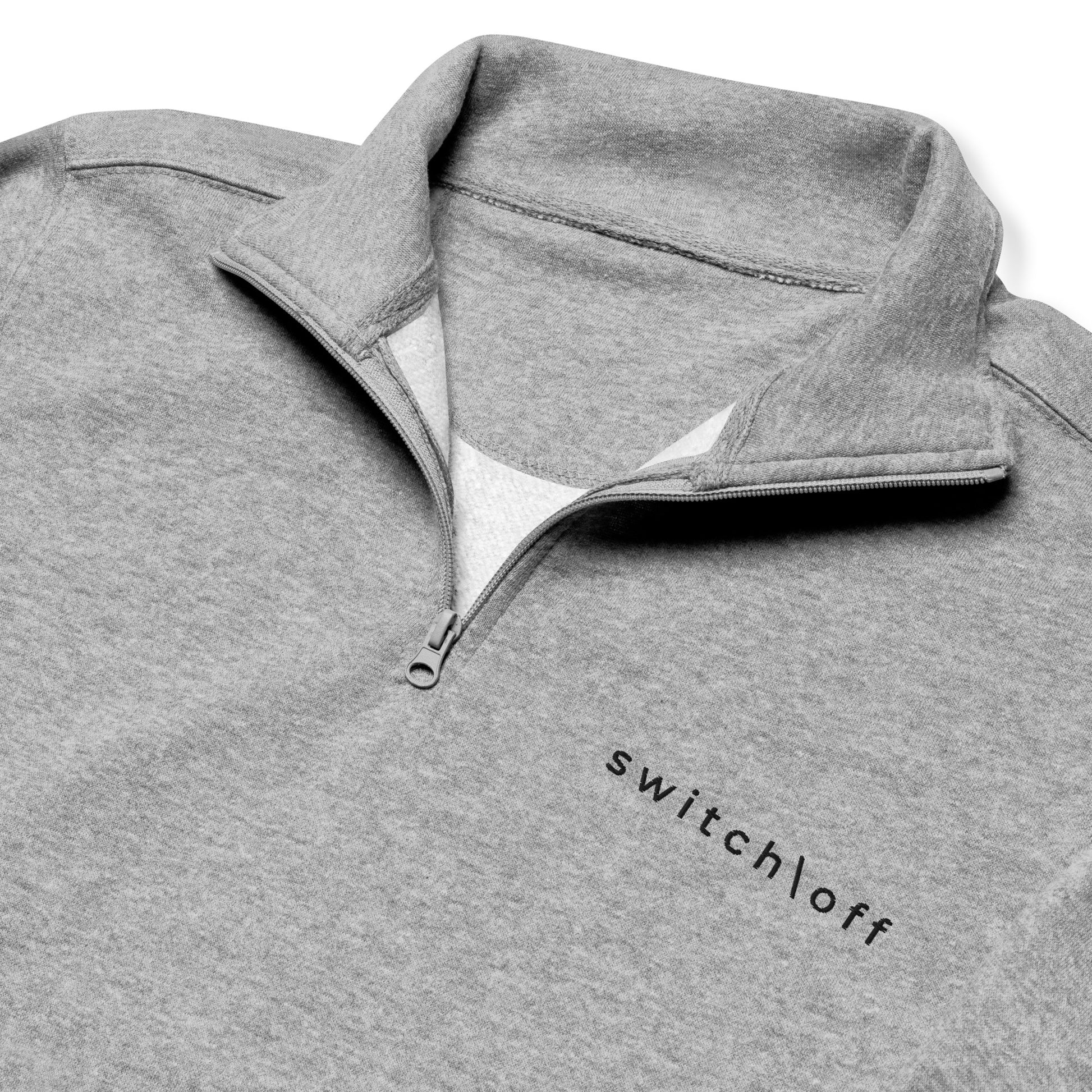 Soft fleece pullover in carbon gray with black switch\off and logo embroidery- An Athlete Trains.