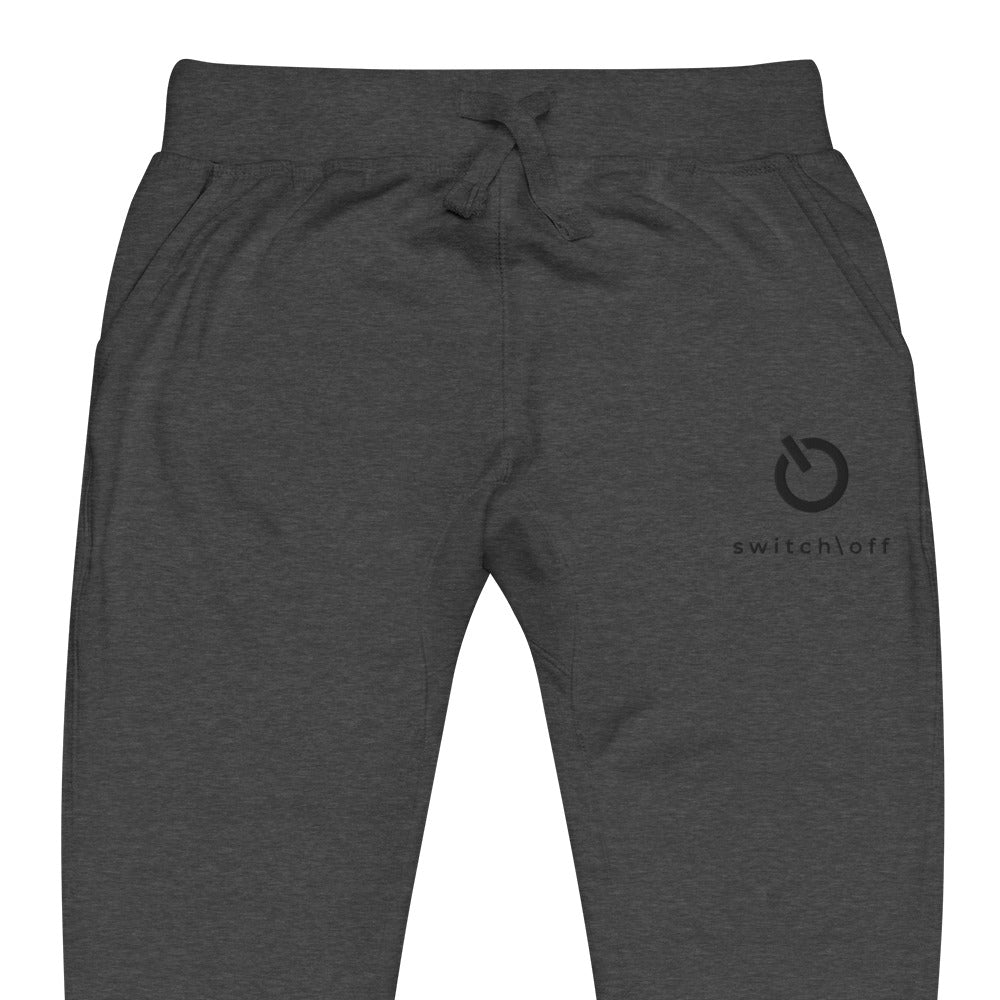 Premium 3-end fleece sweatpants with a soft cotton face in charcoal heather gray with black switch\off and logo embroidery - An Athlete Trains.