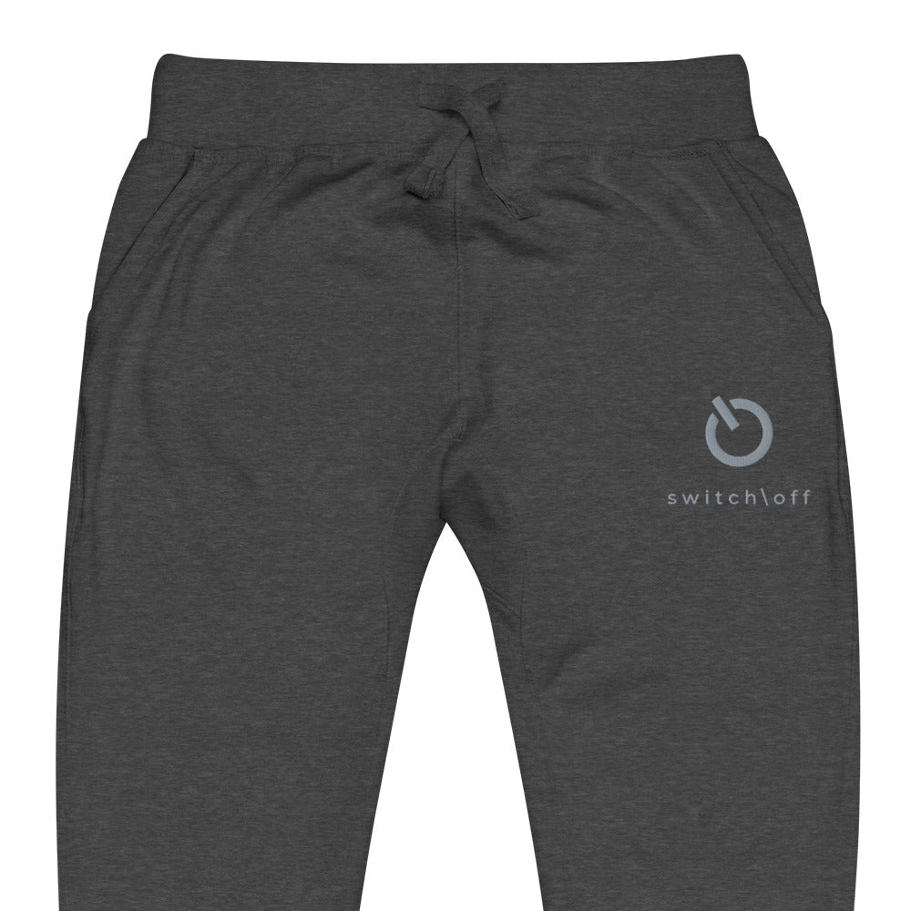 Premium 3-end fleece sweatpants with a soft cotton face in charcoal heather gray with gray switch\off and logo embroidery - An Athlete Trains.