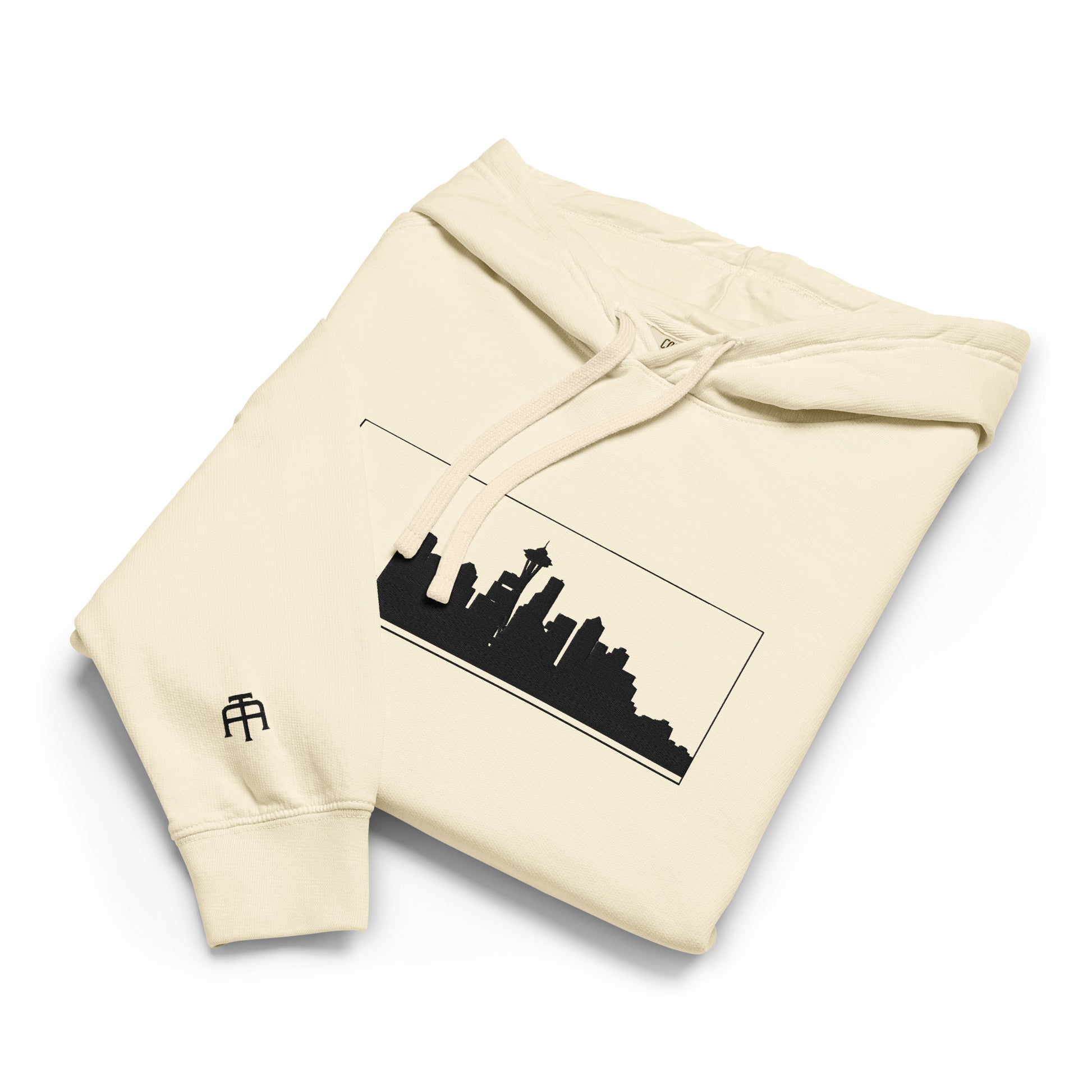 Ivory Seattle Edition lightweight garment-dyed hoodie featuring Seattle skyline, Space Needle, and SEA wrist embroidery | Our City | An Athlete Trains